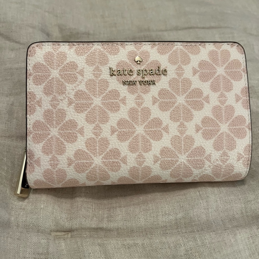 Kate Spade Pink Wallet with Elegant Spade Design used 2 times